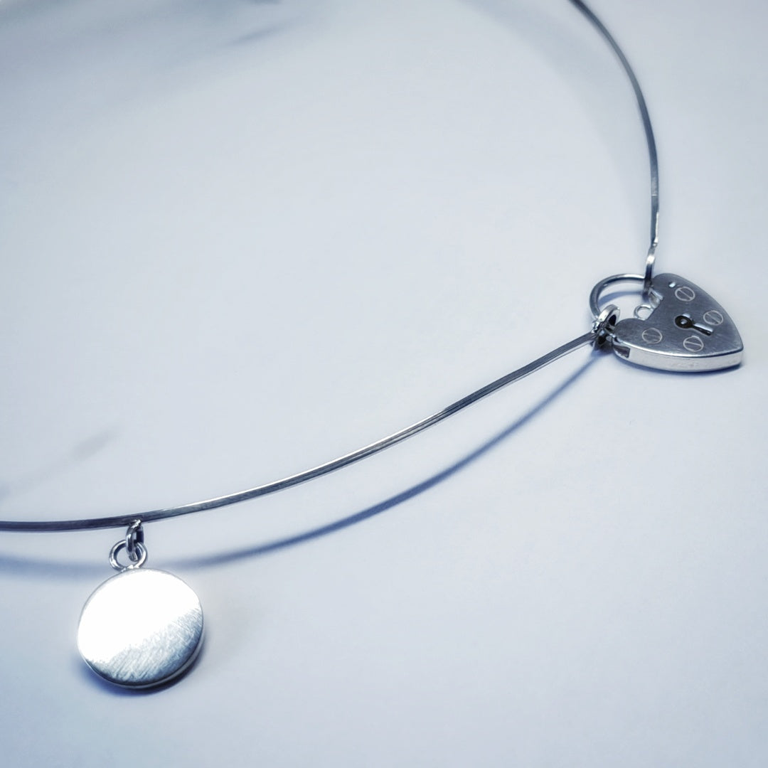 Minimalist Silver necklace with heart lock
