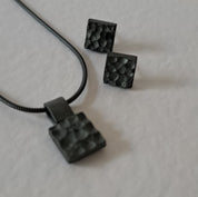 Handcrafted black oxidised sterling silver jewellery set featuring a sculptural pendant and matching stud earrings inspired by architecture and the SONYJA MINI Collection.