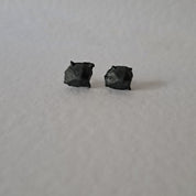 Handcrafted Futurist Brutalist Pebble Stud Earrings in black oxidised sterling silver featuring an organic sculptural texture inspired by architecture and natural stone.