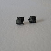 Handcrafted Futurist Brutalist Pebble Stud Earrings in black oxidised sterling silver featuring an organic sculptural texture inspired by architecture and natural stone.