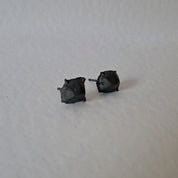 Handcrafted Futurist Brutalist Pebble Stud Earrings in black oxidised sterling silver featuring an organic sculptural texture inspired by architecture and natural stone.