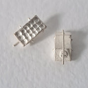 Handcrafted sculptural sterling silver stud earrings from the SONYJA MINI Collection with textured geometric design.