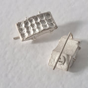 Handcrafted sculptural sterling silver stud earrings from the SONYJA MINI Collection with textured geometric design.