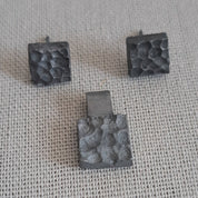 Handcrafted black oxidised sterling silver jewellery set featuring a sculptural pendant and matching stud earrings inspired by architecture and the SONYJA MINI Collection.