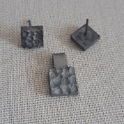 Handcrafted black oxidised sterling silver jewellery set featuring a sculptural pendant and matching stud earrings inspired by architecture and the SONYJA MINI Collection.