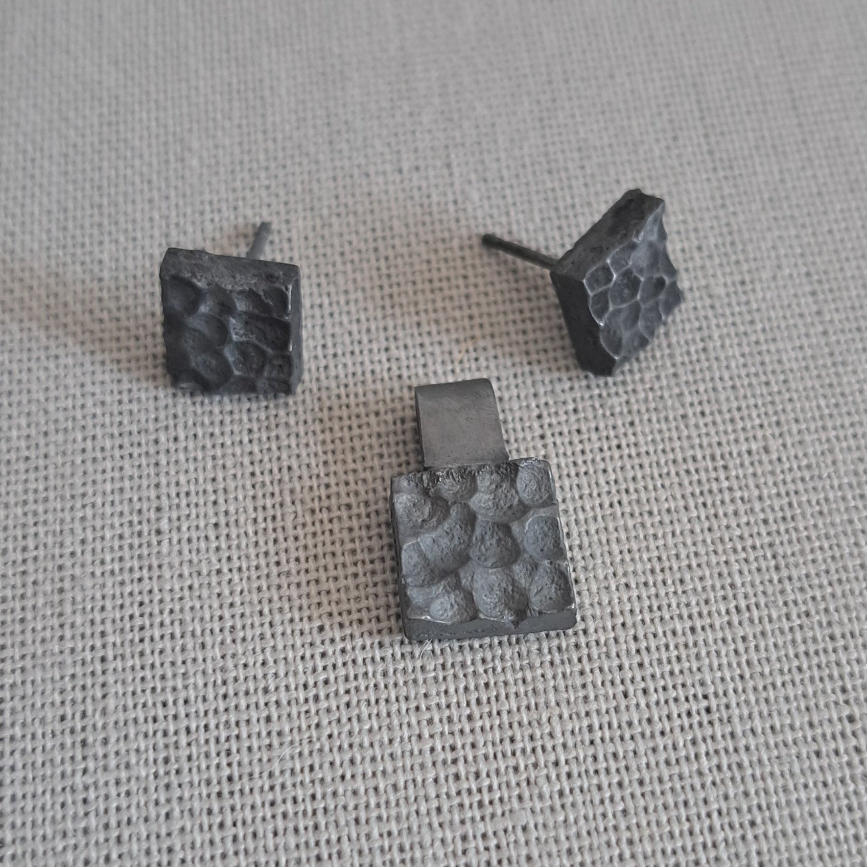 Handcrafted black oxidised sterling silver jewellery set featuring a sculptural pendant and matching stud earrings inspired by architecture and the SONYJA MINI Collection.