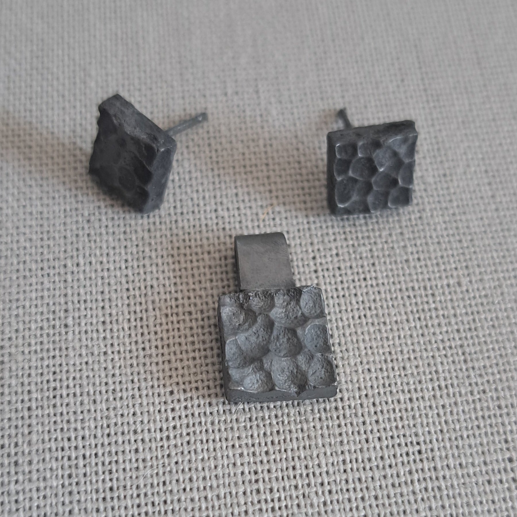 Handcrafted black oxidised sterling silver jewellery set featuring a sculptural pendant and matching stud earrings inspired by architecture and the SONYJA MINI Collection.