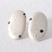Handmade textured silver earrings with sapphires