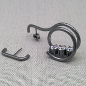 Close-up of zircon stone detail on oxidized recycled silver earring