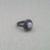 Angled view of oxidised blue lace agate recycled silver ring