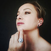 Model wearing blue lace agate silver ring near face
