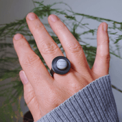 Blue lace agate oxidised silver ring worn on hand outdoors