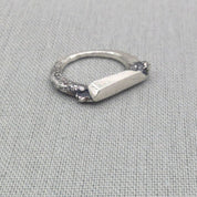Brutalist sculptural recycled silver ring with textured band, full view
