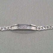 Front view of recycled silver ID bracelet showing hammered plaque