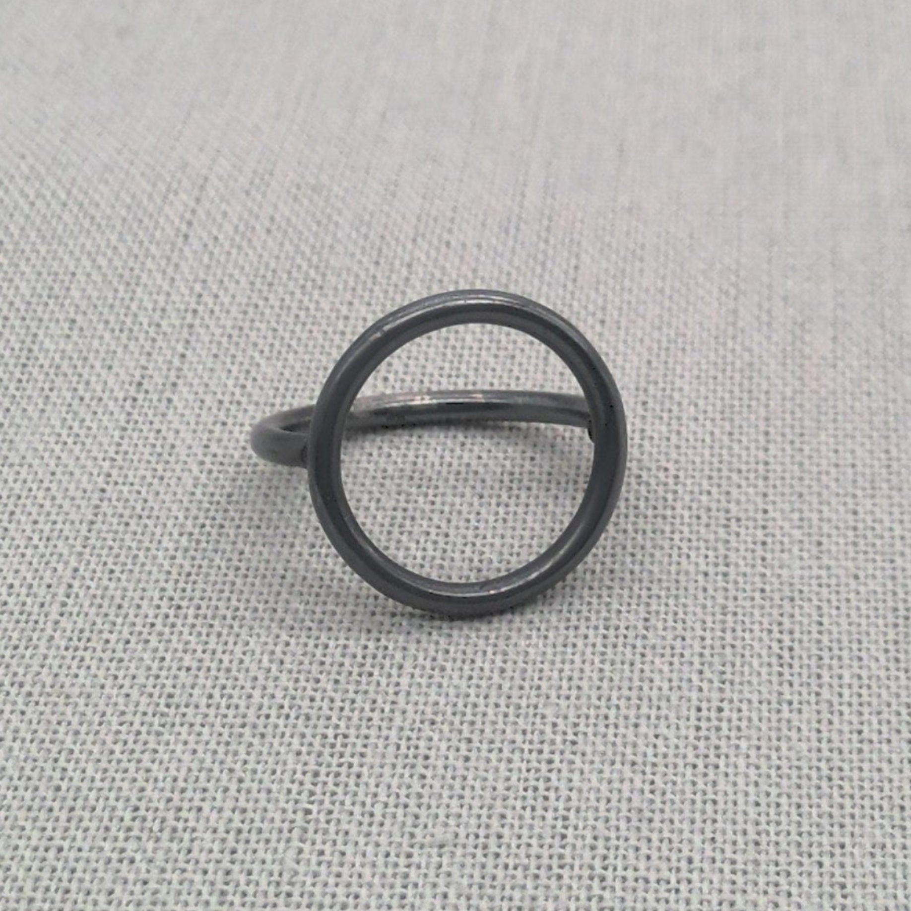 Front view of black oxidised circle silver ring