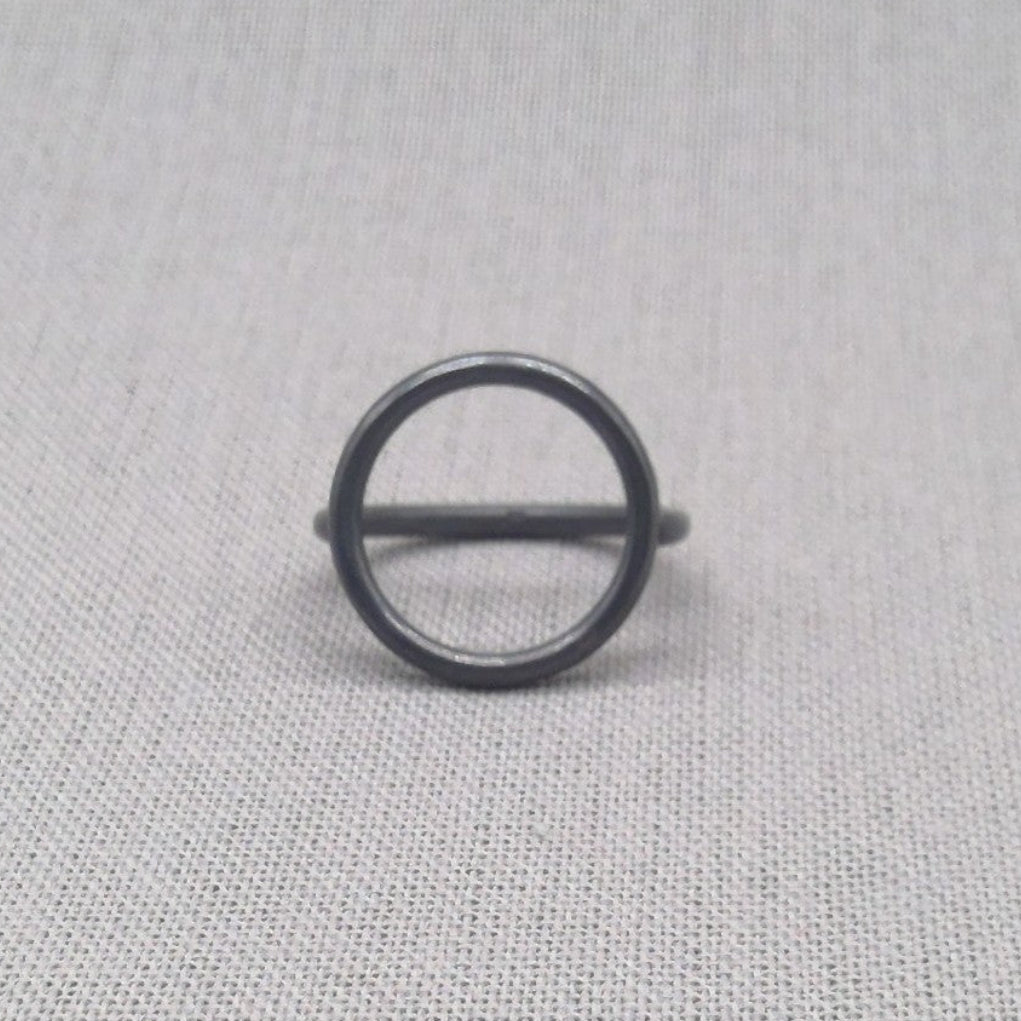Side view of black oxidised sculptural circle silver ring