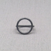 Side view of black oxidised sculptural circle silver ring