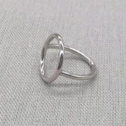 Detail view of polished silver circle ring geometric line