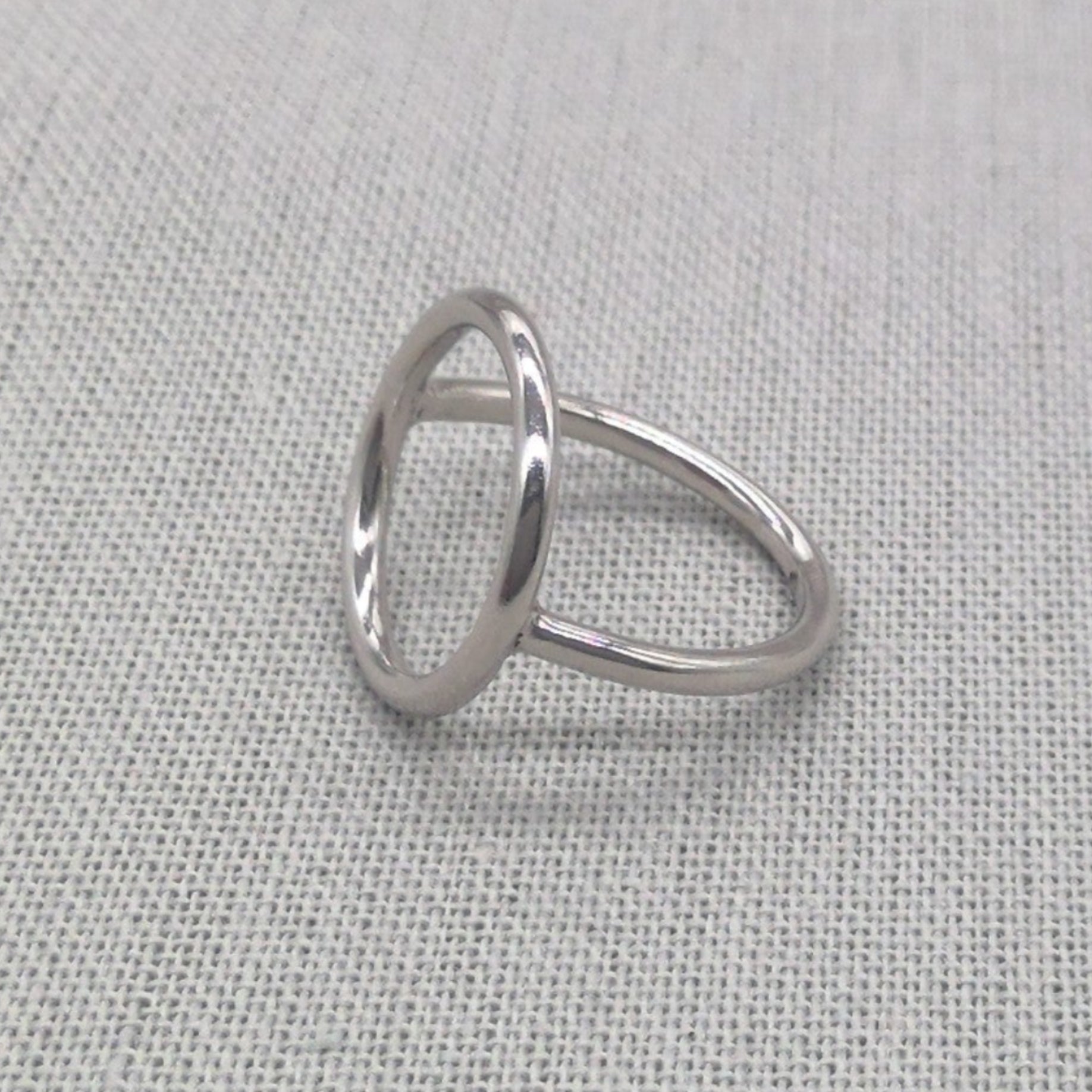 Detail view of polished silver circle ring geometric line