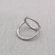 Top-down view of polished silver circle ring