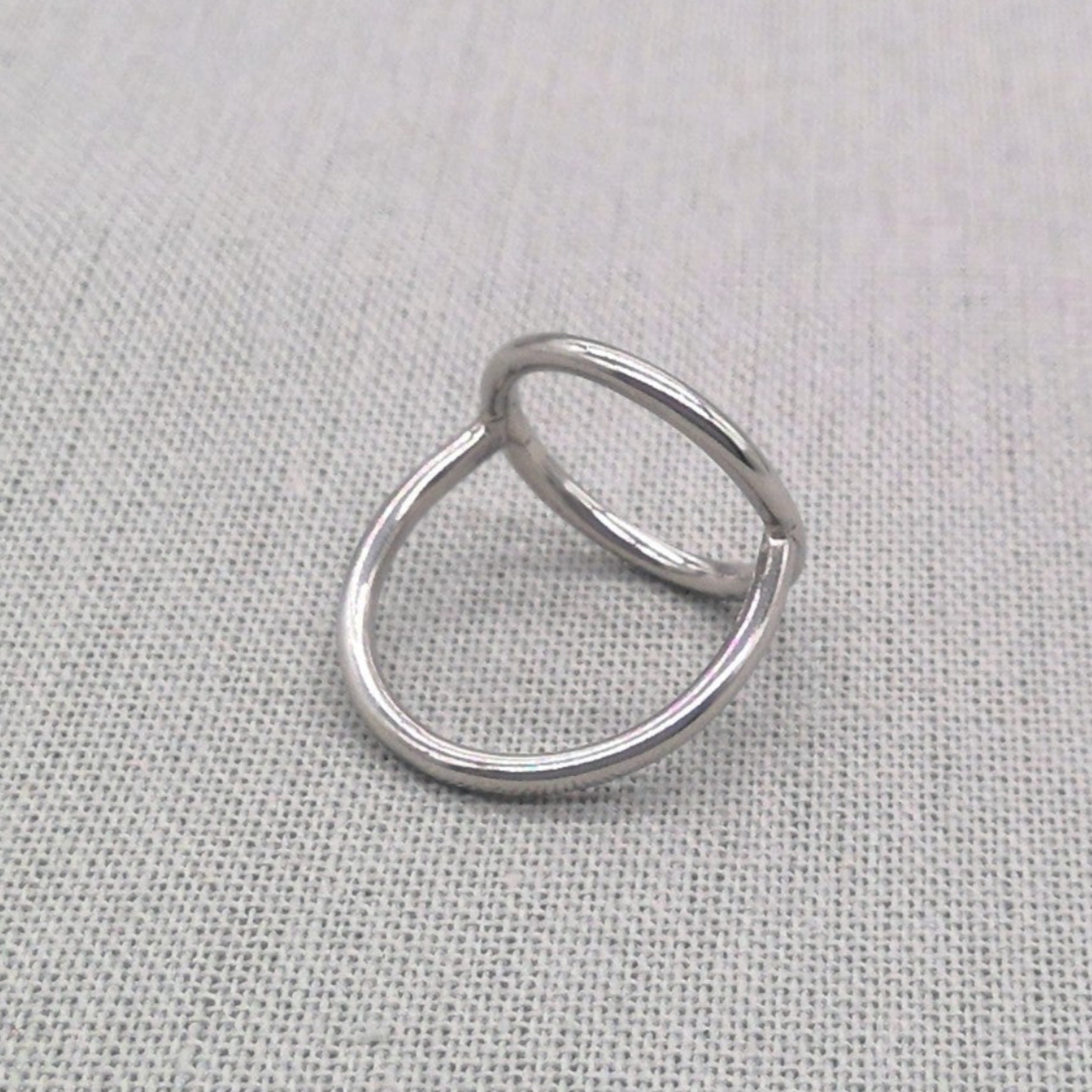 Top-down view of polished silver circle ring