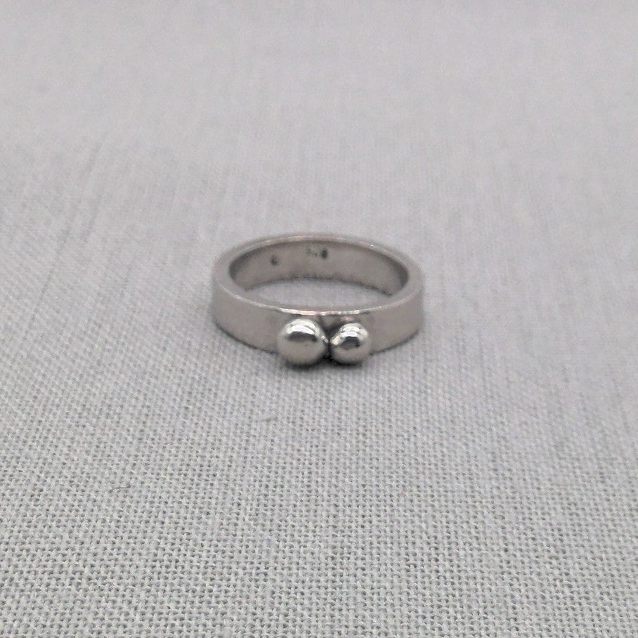 Front view of chunky double ball recycled silver ring
