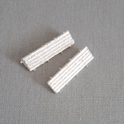Sterling silver ribbed bar earrings, white finish detail