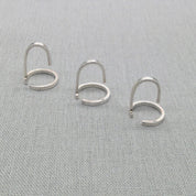 Alternate flat lay of Gladiator collection silver wrap rings