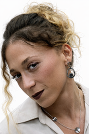 Model wearing hammered silver double circle zircon earring