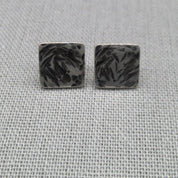 Close-up of oxidized hammered texture on square recycled silver studs