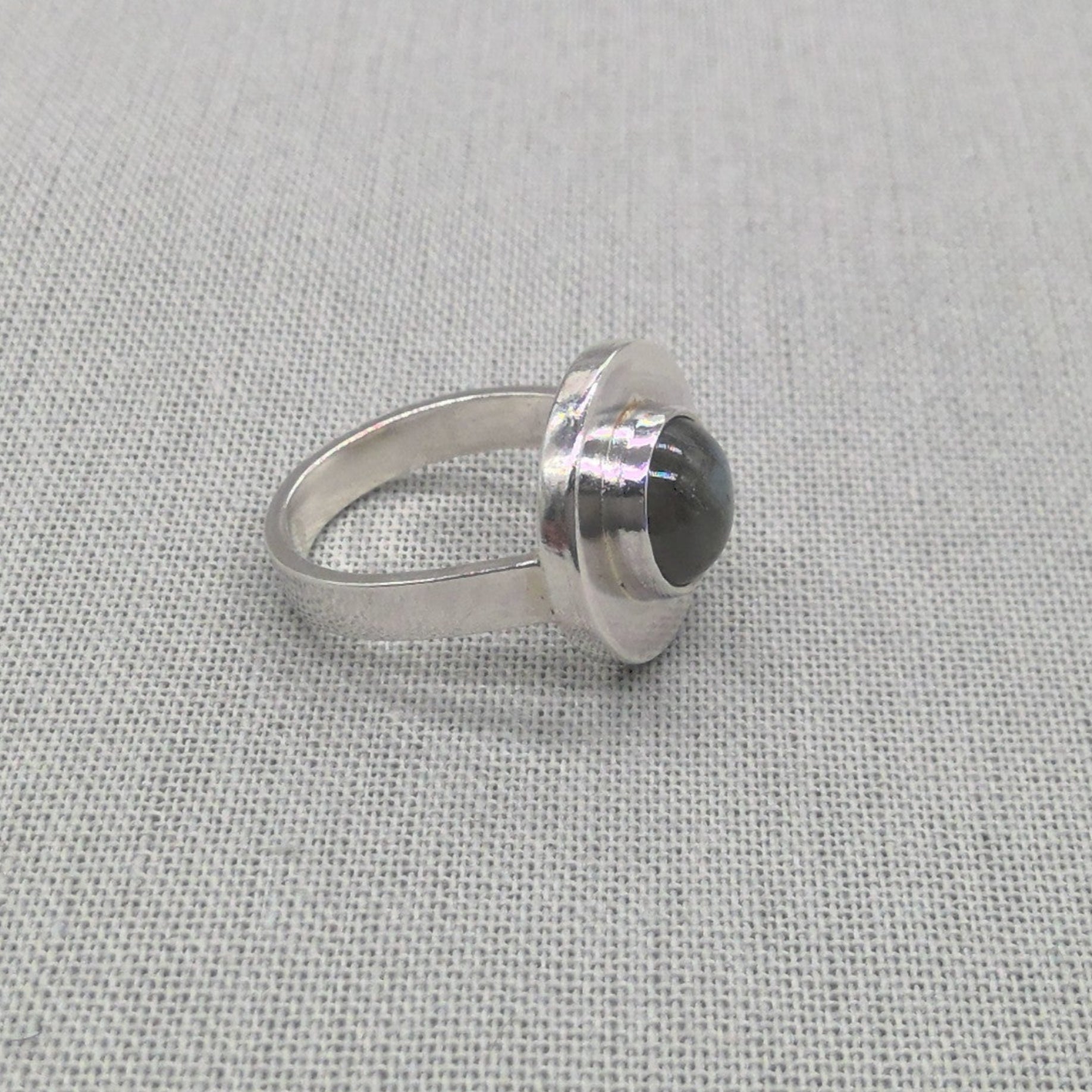 Front view of labradorite cabochon set in recycled silver ring