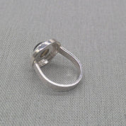 Side profile of labradorite recycled silver ring showing bezel setting