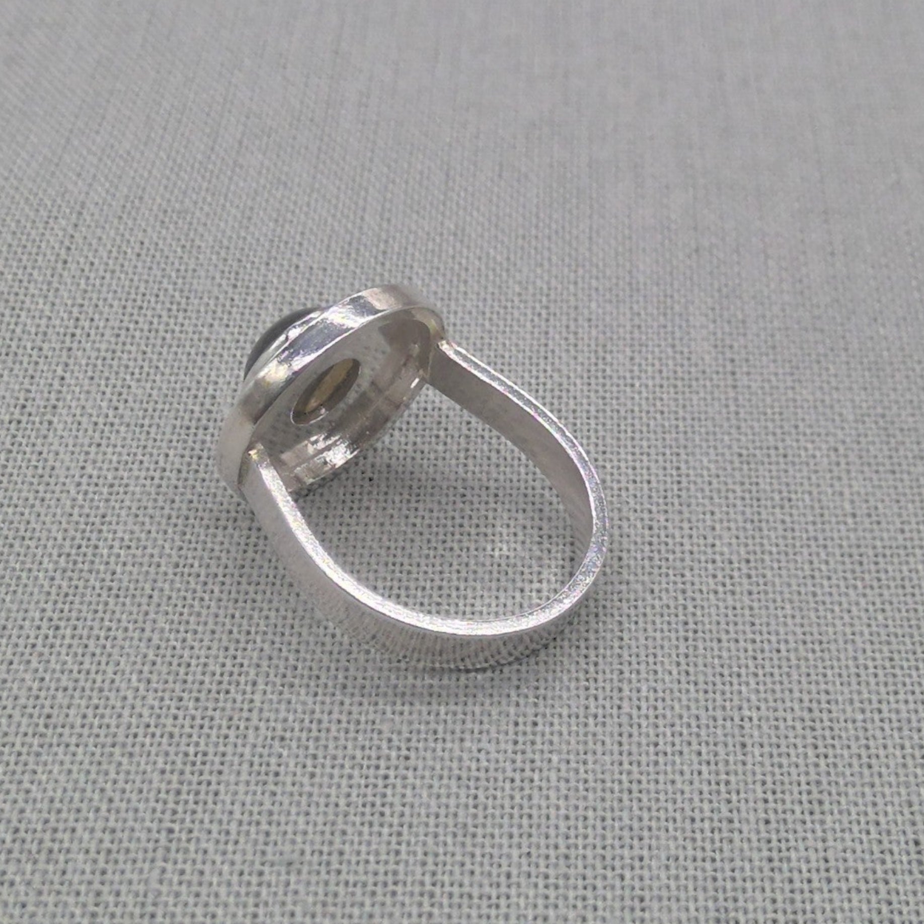 Side profile of labradorite recycled silver ring showing bezel setting
