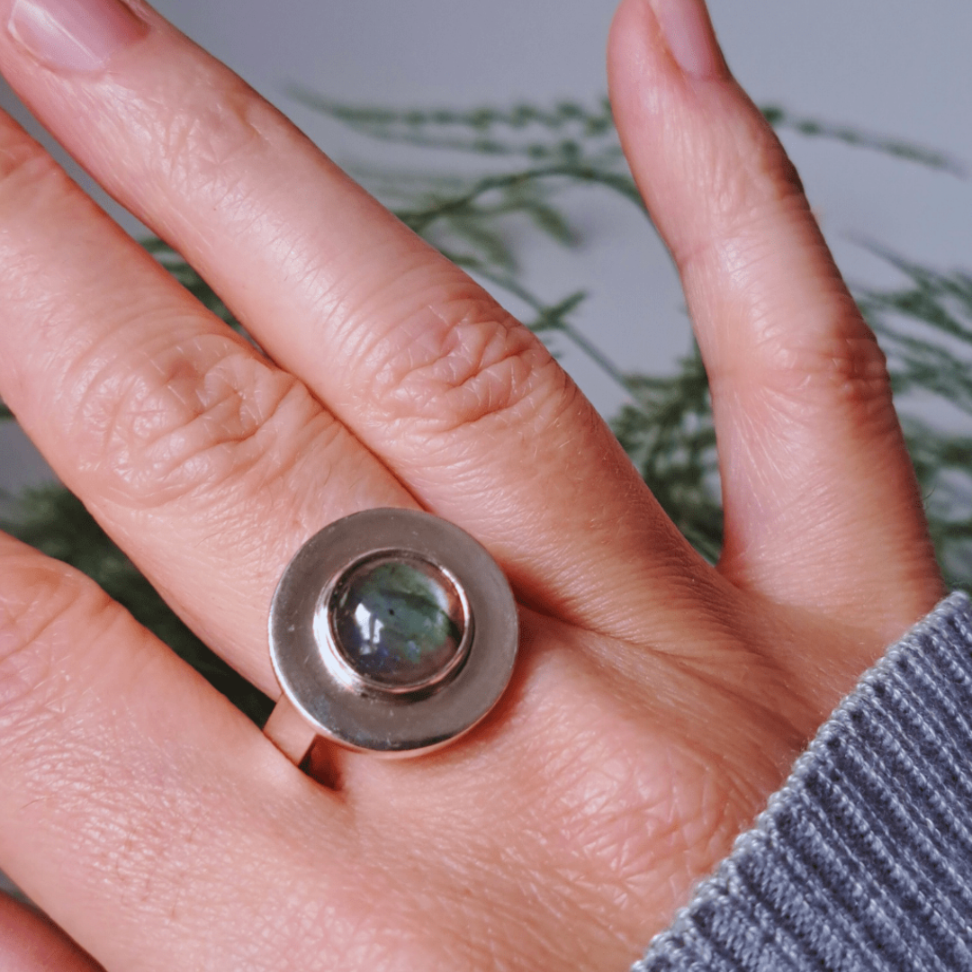Labradorite recycled silver ring worn on hand outdoors