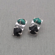 Angled view of malachite and obsidian silver earrings