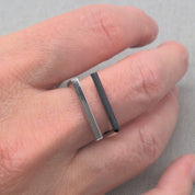 Minimalist recycled silver ring worn stacked on finger