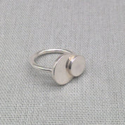 Side view of personalised silver ring showing two connected discs
