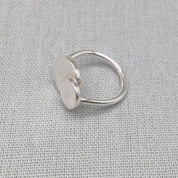 Top-down view of mother daughter personalised silver ring