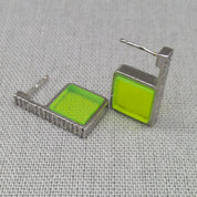 Front view of neon green hammered recycled silver earrings