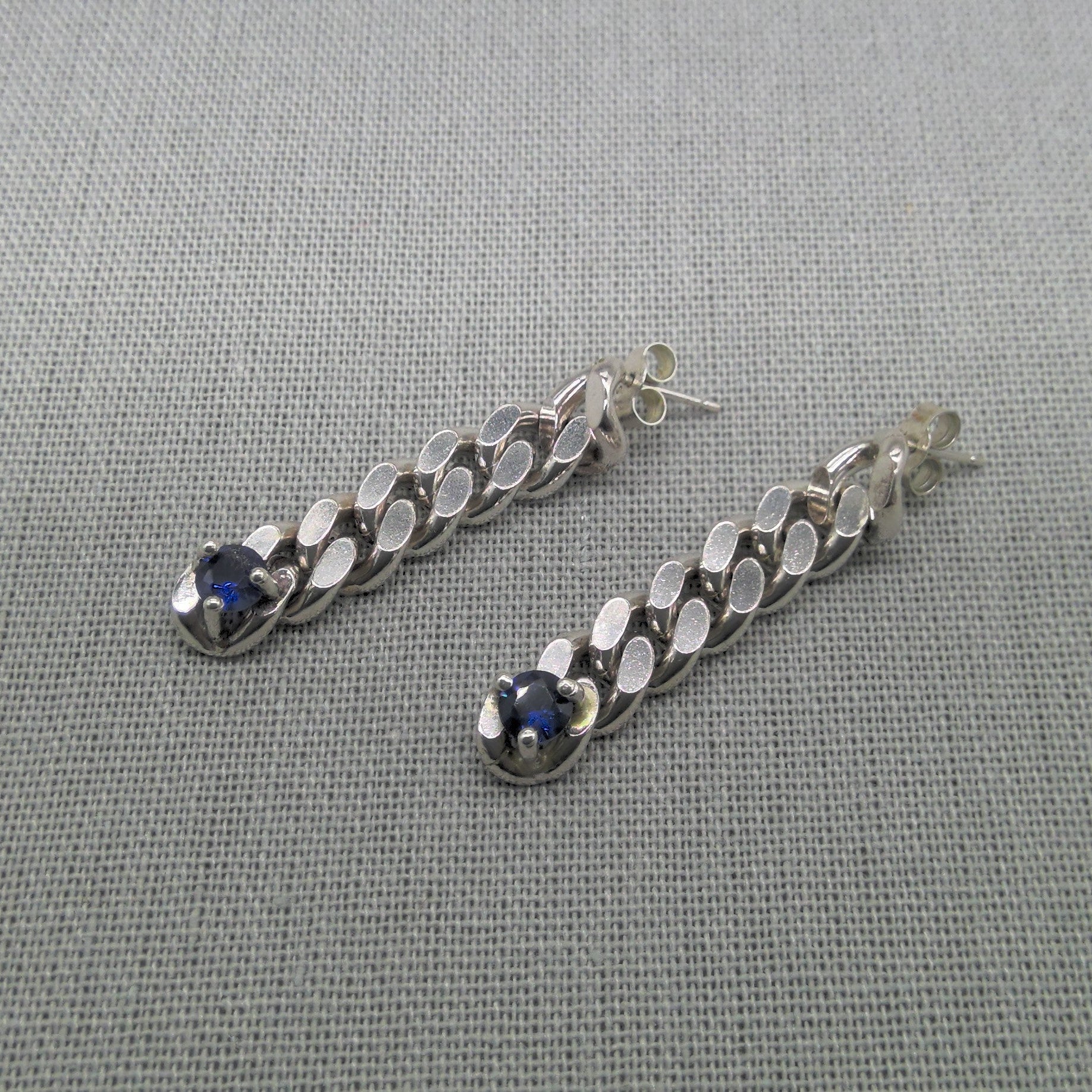 Silver curb chain drop earrings with sapphire stones
