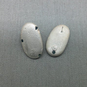 Organic textured silver pebble earrings, coastal jewellery design
