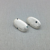 Sterling silver pebble earrings with blue sapphire detail