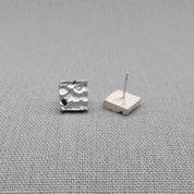 Sterling silver stud earring with blue sapphire, side view