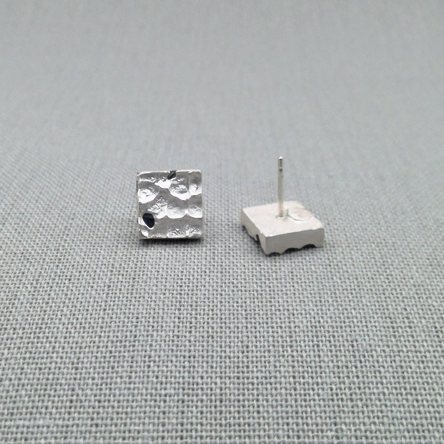 Blue sapphire sterling silver stud earrings, textured surface detail