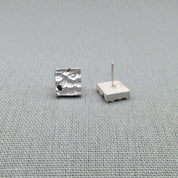 Blue sapphire sterling silver stud earrings, textured surface detail