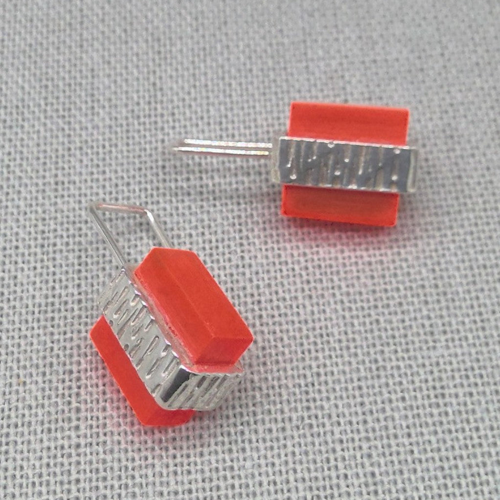 Orange textured recycled silver stud earrings, full pair view