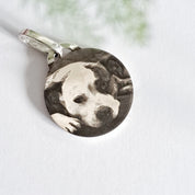 Close-up of pet photo engraved on recycled silver pendant