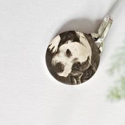 Front detail of engraved dog photo on recycled silver pendant
