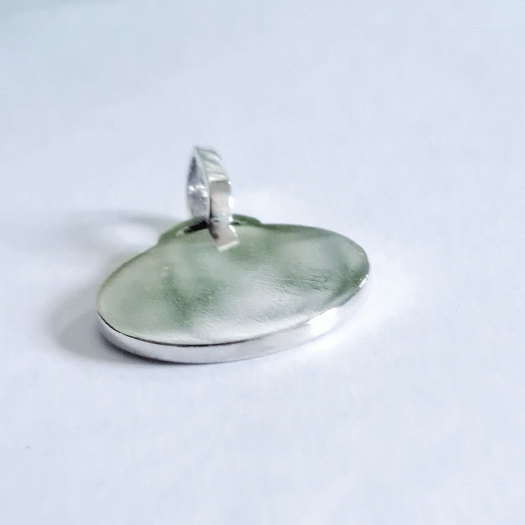 Side view of recycled silver pet photo pendant showing bail