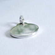 Side view of recycled silver pet photo pendant showing bail